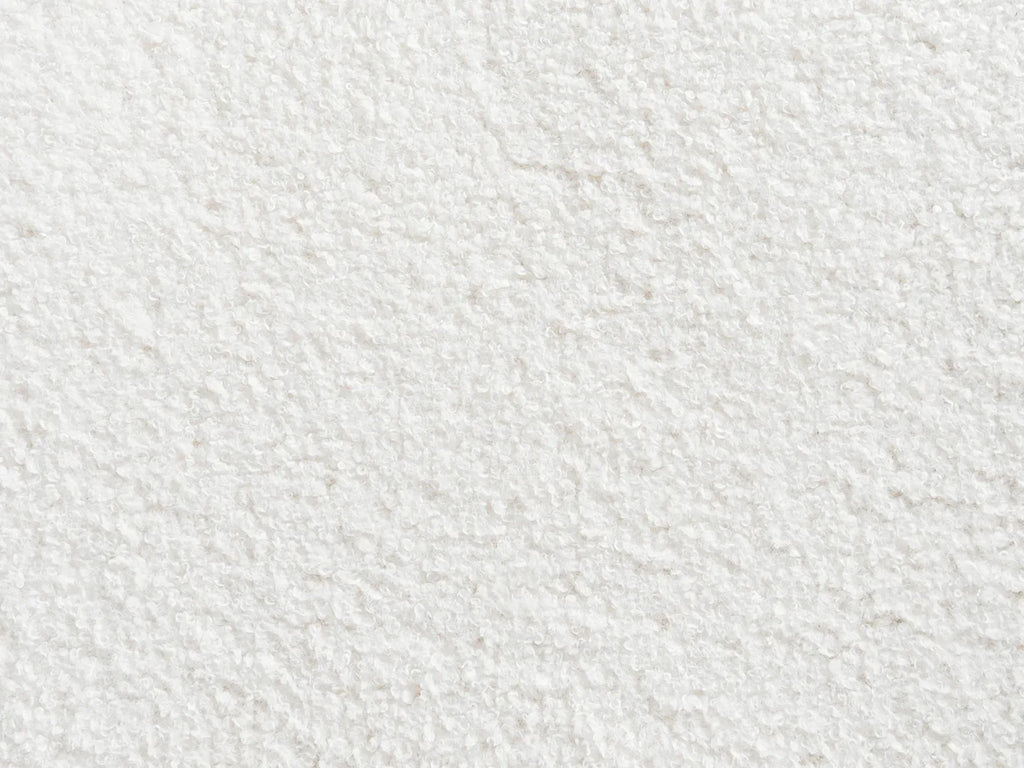 Pouf capitonné en bouclé blanc cassé